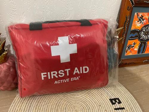 a red first aid bag sitting on top of a rug at Résidence Koto in Dakar