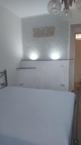 a white refrigerator in a kitchen with lights on it at Casa del cuore in Barrea
