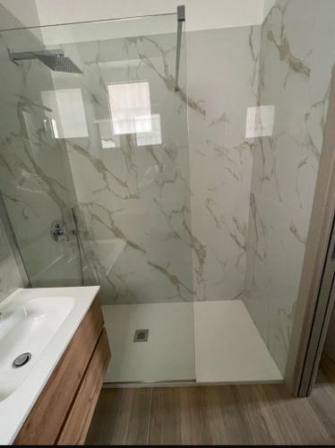 a bathroom with a shower and a sink at Marconi B&B - Holiday Home in Marconia