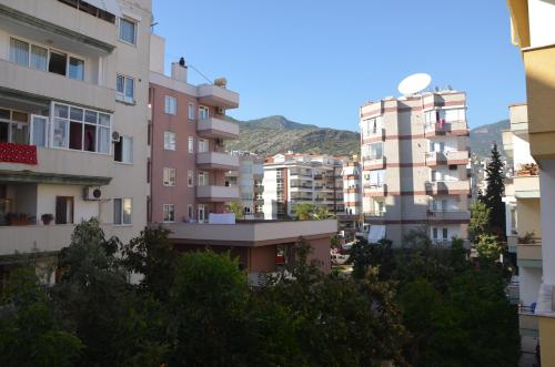a group of tall buildings in a city at Twin Apart Hotel in Alanya