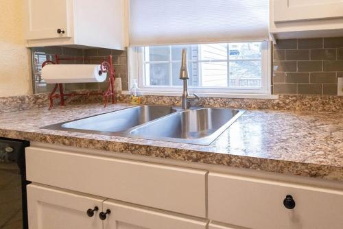 a kitchen counter with a sink and a window at Lakeview Latitude in Holiday Island