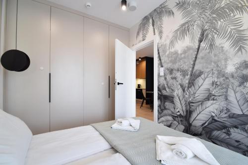 Katil atau katil-katil dalam bilik di Perłowa Przystań Apartament Sealife by LookAp przy plaży, klimatyzacja, parking
