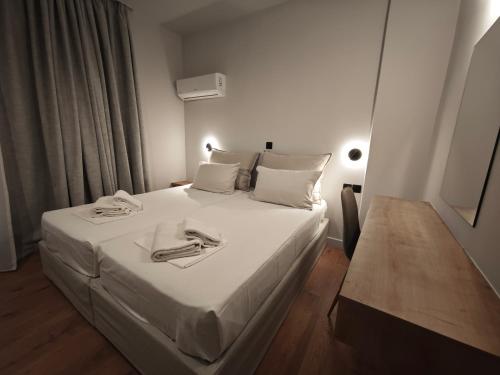 9 Muses Apartmentsにあるベッド