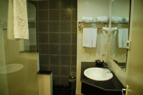 Koupelna v ubytování Mina Hotel