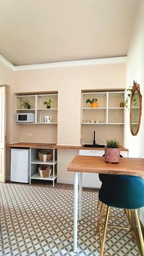 a dining room with a table and a mirror at Brindisina Apartment in Turin