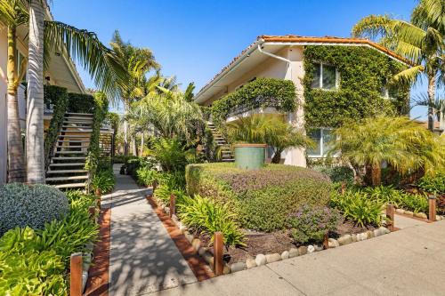 a house with trees and plants in front of it at Los Aguajes in Santa Barbara