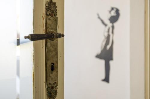 a door with a silhouette of a woman on it at Nel Blu in Menaggio
