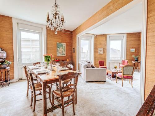 a dining room with a table and chairs at Apartment L'écluse-3 by Interhome in Dinard