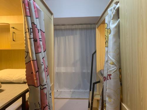 Katil atau katil-katil dalam bilik di Backpacker's Utopia Youth Hostel