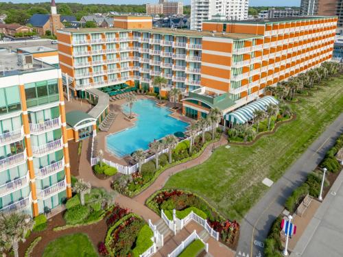 an aerial view of a resort with a swimming pool at Holiday Inn & Suites Virginia Beach - North Beach by IHG in Virginia Beach