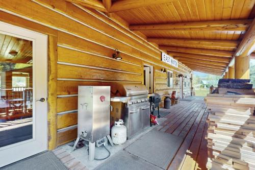 a porch of a house with a stove and a building at Forestside Lodge in Leavenworth