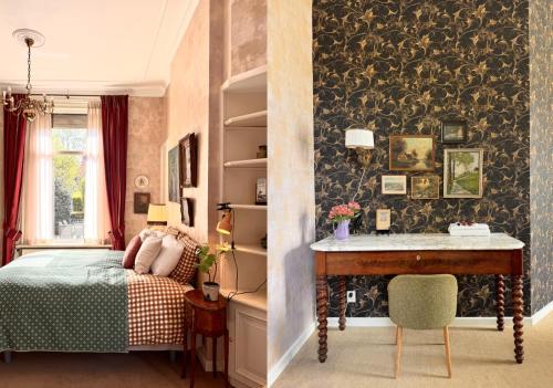 a bedroom with a bed and a desk and a table at Villa Abbekerk - Bed & Breakfast in Abbekerk