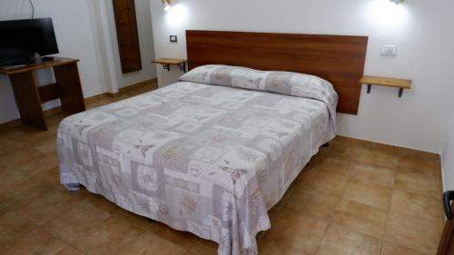 Postel nebo postele na pokoji v ubytování Agriturismo Su Solianu
