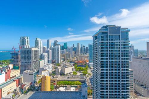 an aerial view of a city with tall buildings at Bright and Breezy 1 Bed Unit With Water and City Views in Miami