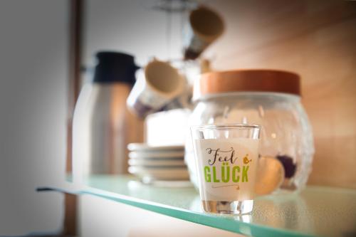 a glass jar with a label on it sitting on a shelf at Trackside Loft in Amberg