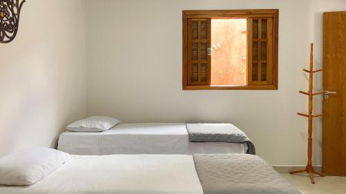 Vila Bonita Guest Houseにあるベッド