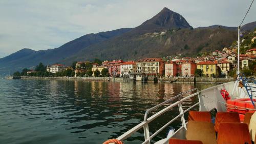 a boat in a body of water with a town at Casa Mauro I in Trarego Viggiona