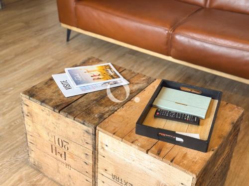 a coffee table with a scale on top of a wooden box at COC - La Palme in Wissant