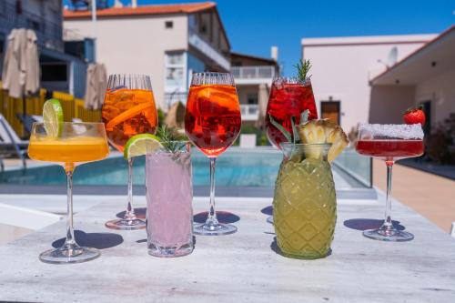 a group of wine glasses sitting on a table at GAIA Suites in Fanárion