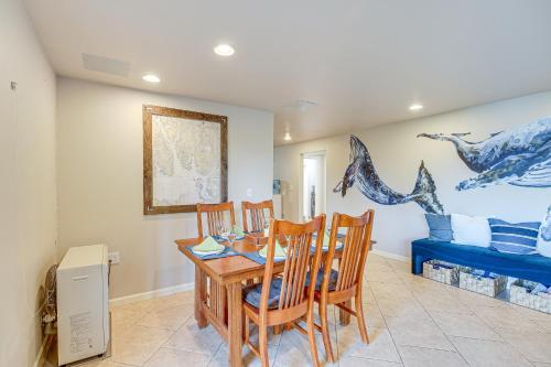 a dining room with a table and chairs and a bedroom at Fish and Hike Apartment with Pool Table in Ketchikan! in Ketchikan
