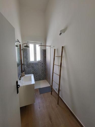 a bathroom with a sink and a mirror at Casa Ianca in Lecce