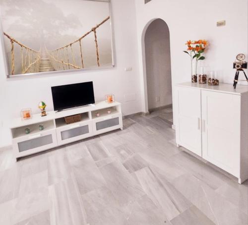 Et tv og/eller underholdning på Bombo Beach Appartement