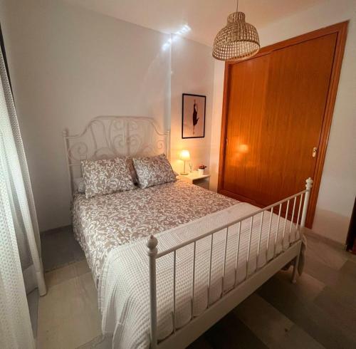 En eller flere senge i et værelse på Bombo Beach Appartement