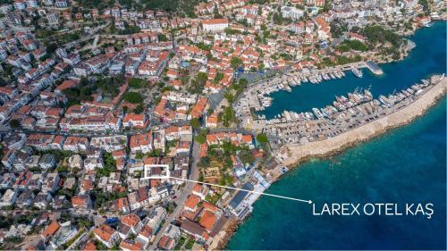 an aerial view of a city next to the water at Larex Otel in Kas