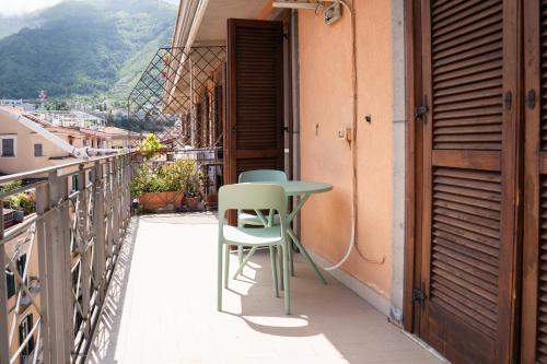 a table and chair on the balcony of a building at Stabiae Suite Sorrento Coast Suites in Castellammare di Stabia