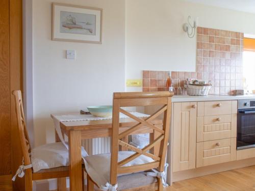 a kitchen with a table with a bowl on it at Holiday Home Bothan Aonghais by Interhome in Kilmuir