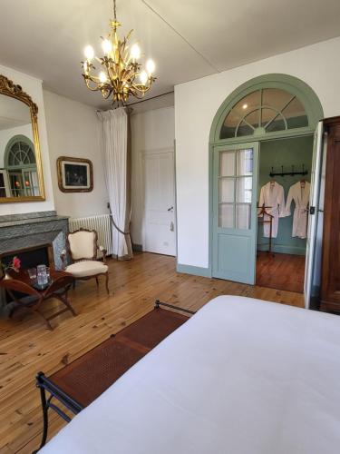 Postel nebo postele na pokoji v ubytování Maison d'Hôtes L'Intemporelle