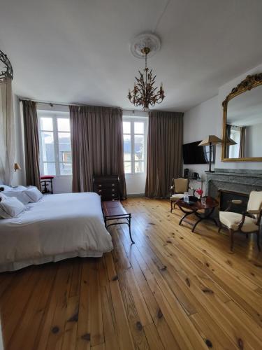 Postel nebo postele na pokoji v ubytování Maison d'Hôtes L'Intemporelle