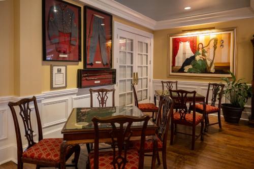 a dining room with a table and chairs at The Marshall House, Historic Inns of Savannah Collection in Savannah