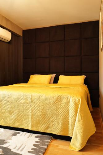Ένα ή περισσότερα κρεβάτια σε δωμάτιο στο SkopjeLUX Apartments