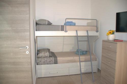a bedroom with two bunk beds and a dresser at Sweet dreams AF in Palermo