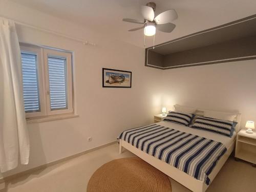 Postel nebo postele na pokoji v ubytování Apartments Grbin