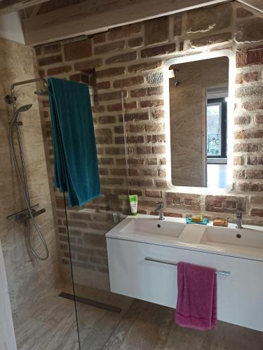 a bathroom with a sink and a mirror at Nové podkrovie umelca in Trnava