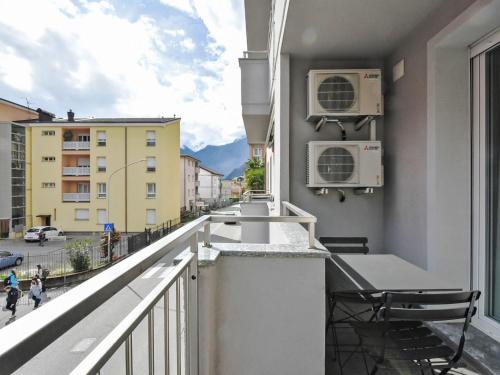 a balcony with a view of a city at Apartment Marconi by Interhome in Chiavenna