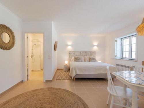 a large bedroom with a bed and a table at Apartment Natura Bliss Studio by Interhome in Alcácer do Sal