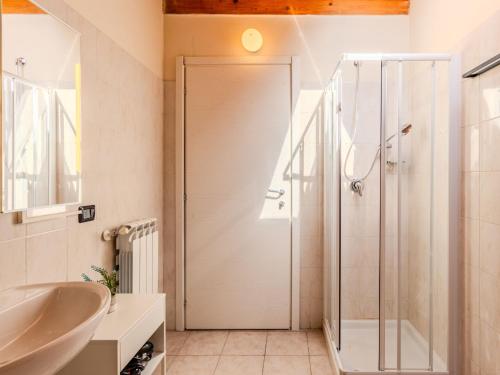 a bathroom with a shower and a sink at Apartment Piazza San Giuseppe-6 by Interhome in Acquaseria
