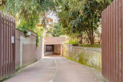 an empty alley with a tunnel in the distance at La Piccola Luxury Suite in Rome