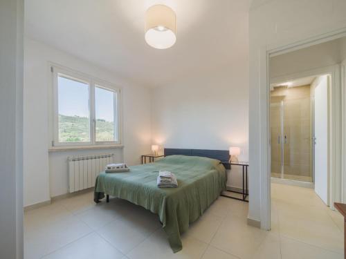 Ένα ή περισσότερα κρεβάτια σε δωμάτιο στο Holiday Home Villa Pardini by Interhome