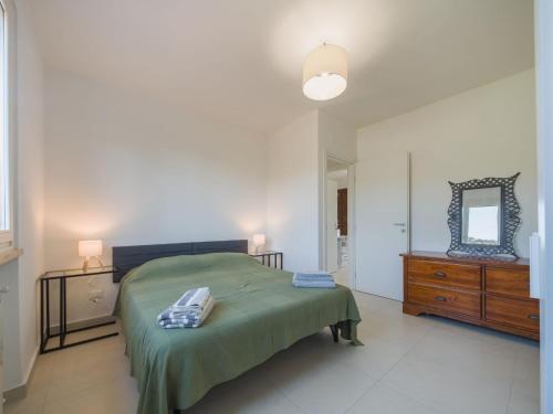 Ένα ή περισσότερα κρεβάτια σε δωμάτιο στο Holiday Home Villa Pardini by Interhome