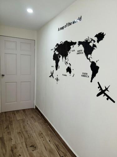 a map of the world wall decal in a room at Dream Island Condo in Buccoo