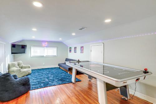 a living room with a ping pong table at 1 Mi to Dtwn Welcoming Macon Home with Yard in Macon