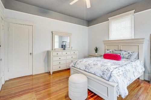a bedroom with a white bed and a window at 1 Mi to Dtwn Welcoming Macon Home with Yard in Macon