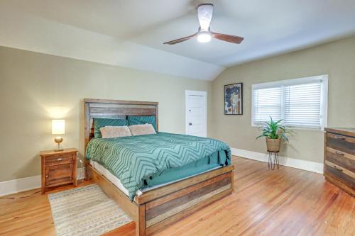 a bedroom with a bed and a ceiling fan at 1 Mi to Dtwn Welcoming Macon Home with Yard in Macon