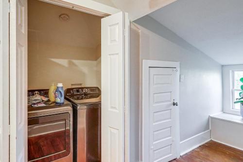a kitchen with a stove and a sink and a door at 1 Mi to Dtwn Welcoming Macon Home with Yard in Macon