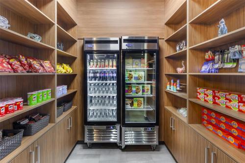 a store with a refrigerator in the middle of shelves at Best Western Plus Hinton Inn & Suites in Hinton