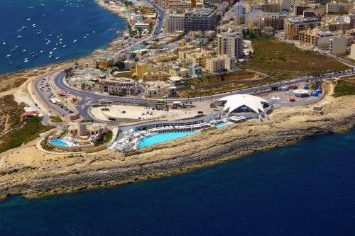 an aerial view of a city and the ocean at Cosy 2 Bedroom Penthouse with Terraces & seaview in St Paul's Bay